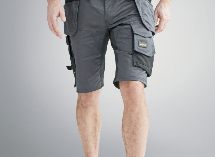 Photo of a man wearing a pair of Snickers grey holster pocket shorts