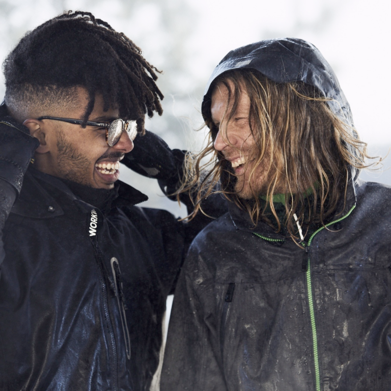 Photo of two men outdoors wearing waterproof jackets